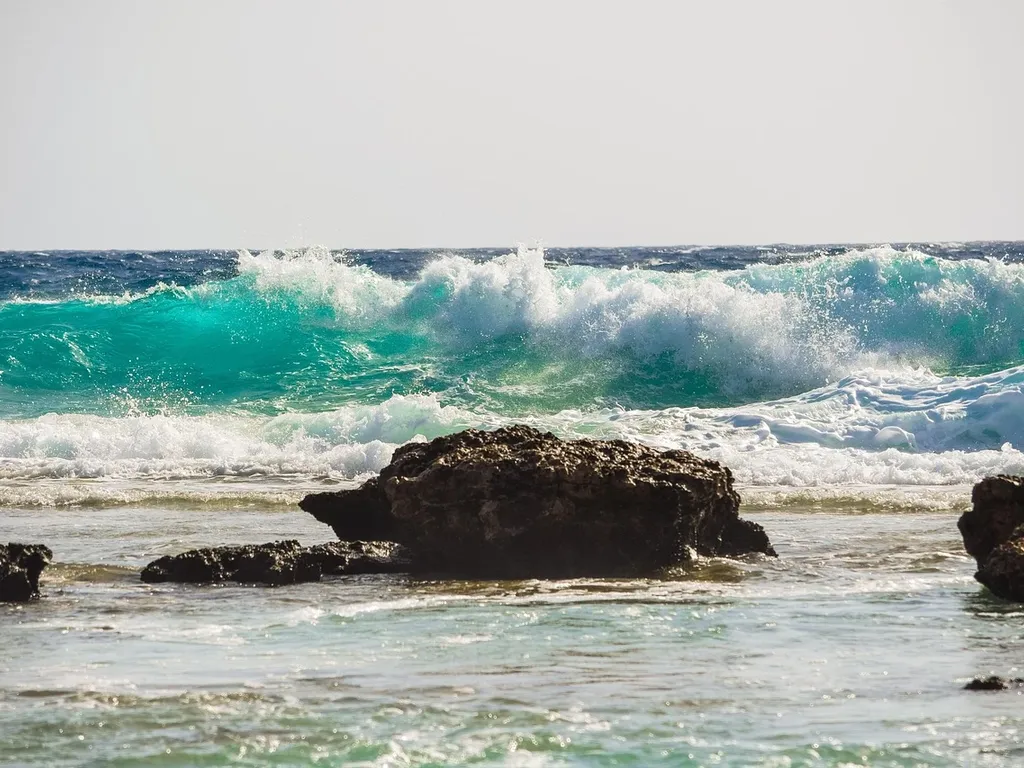 Waves are coming to rocks in Lembongan