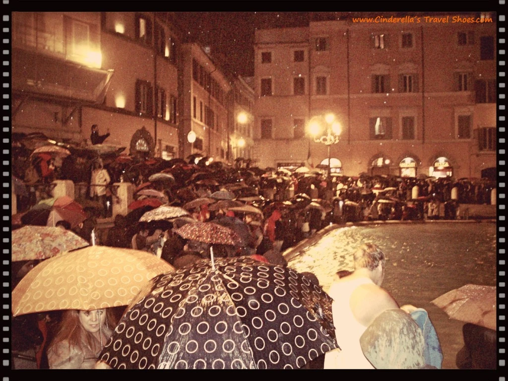 Umbrellas in front of Fontana di Trevi, Rome in Italy