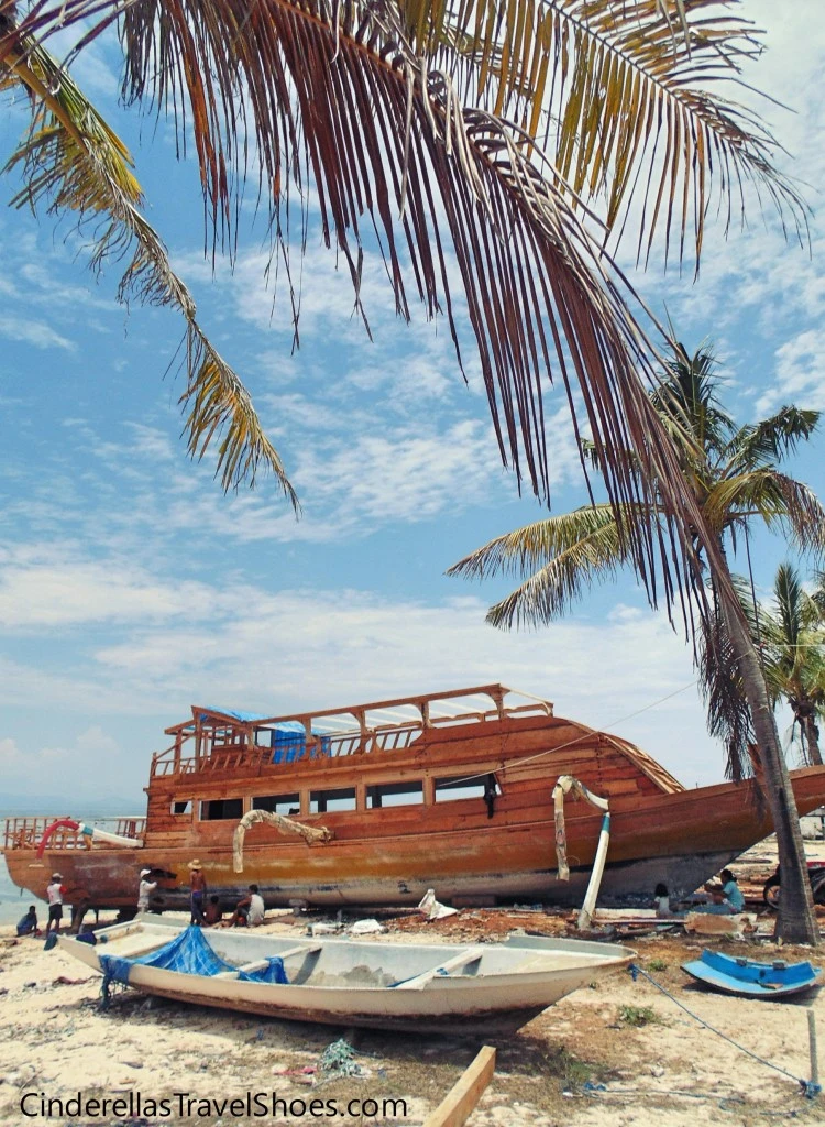 Locals are painting the old ship